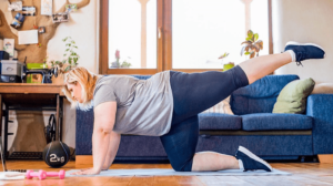 overweight person working out from home